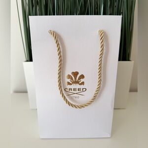 CREED White Bag with Gold Detailing